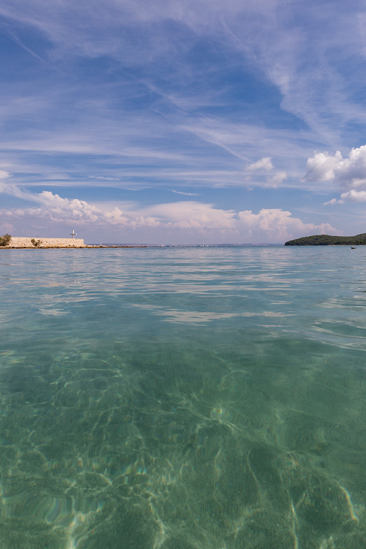 Crystal clear sea of Mostir beach in town Ugljan on island Uglja