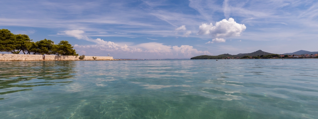 Crystal clear sea of Mostir beach in town Ugljan on island Uglja